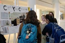 Students looking at research posters