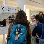 Students looking at research posters