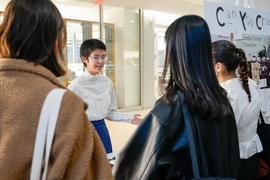 three students talking