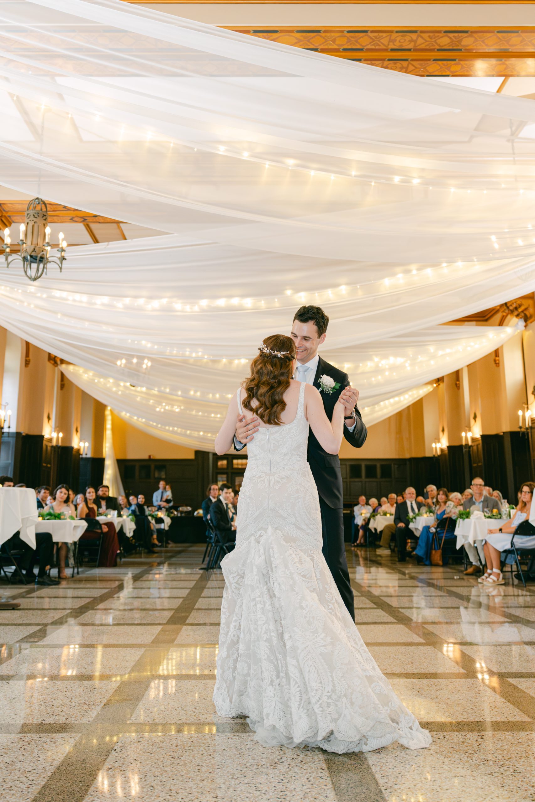 Couple dancing in Great Hall, while guest watch!