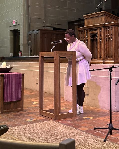 Student sharing their story at National Coming Out Day service