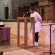 Student sharing their story at National Coming Out Day service