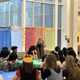 Rabbi Shosh Dworsky speaking to the crowd of students seated at tables