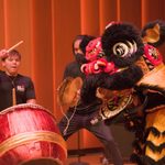 Black lion dancer with drum