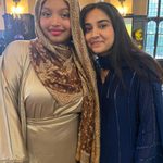 Two students posing together at Eid Celebration