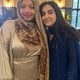 Two students posing together at Eid Celebration