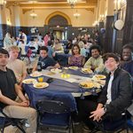 Group of students at a table at Eid celebration