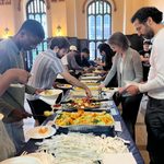 People getting food at buffet tables at Eid Celebration