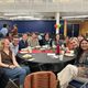 Group of students sitting at a table at the Knightly Iftar
