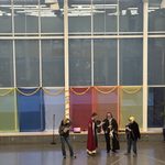 Group of students in costumes speaking at Holi/Purim