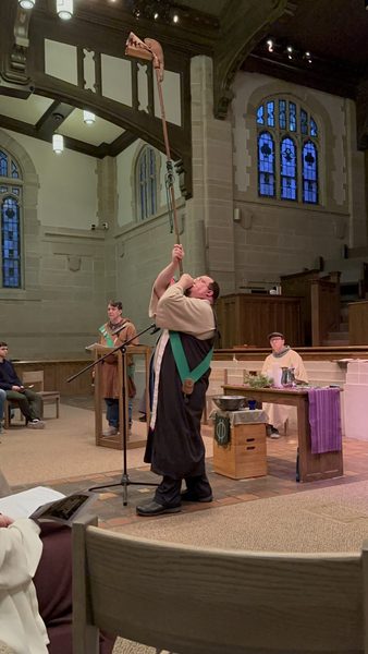 Archdruid of the Oakdale Grove blows a long horn at the Imbolc Service