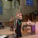 Archdruid of the Oakdale Grove blows a long horn at the Imbolc Service