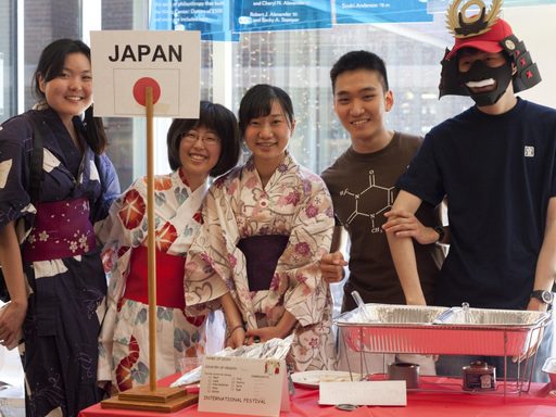 Students in front of Japan table at International Fest
