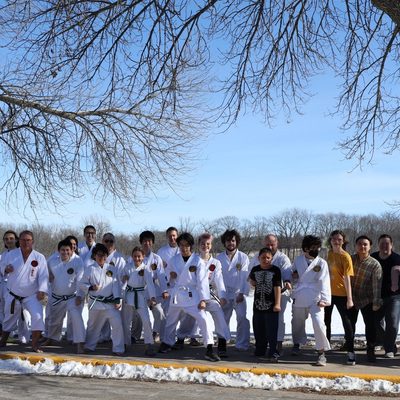 A group photo after a full-belt testing event in February 2024