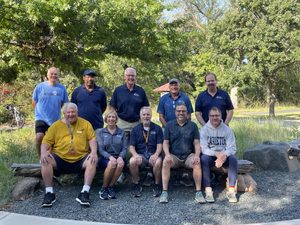 Ten members of the Recreation Center staff sitting and standing outside