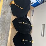 Black and gold tams