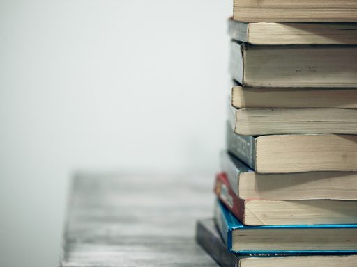 Stack of books against gray background