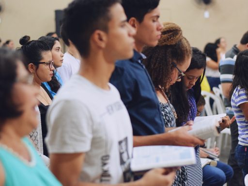 Students standing, holding books