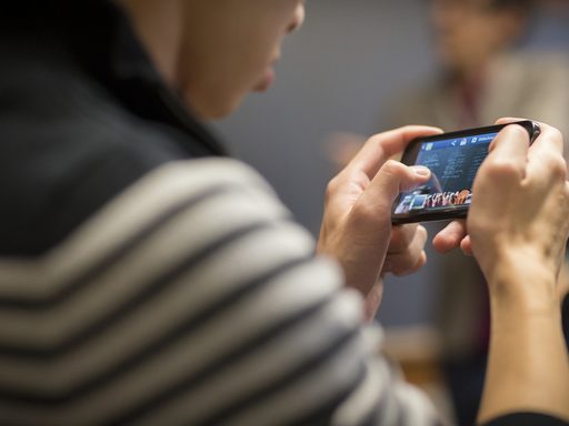 Student with mobile phone.