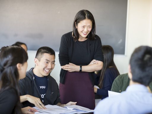 Faculty member working with a group of students