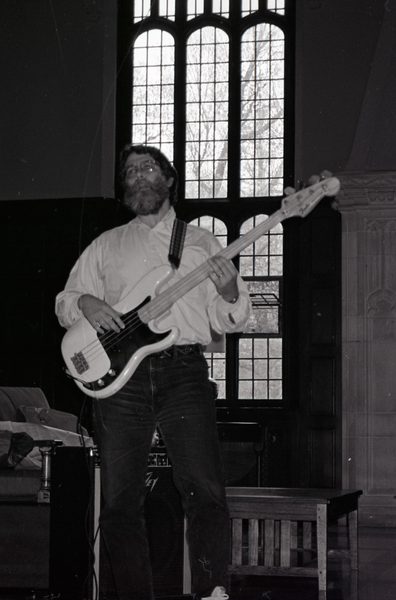 Mark playing a guitar.