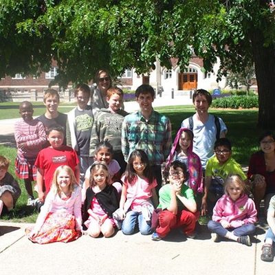 Associate Professor Daniel Groll and philosophy students with elementary students at Greenvale Park.
