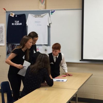 A group of SCOPE students prepares to debate.