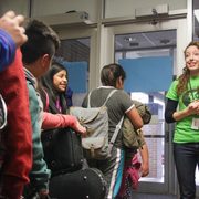 Kathryn Lozada '12 says goodbye to energized students after programming ends for the day.