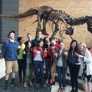 Carleton students pose as dinosaurs at Science Museum