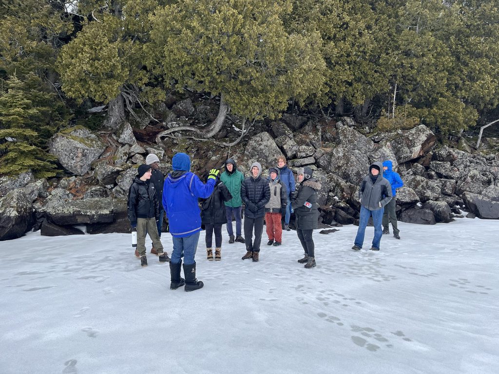 Image of students playing on the ice during an Alternative Spring Break trip