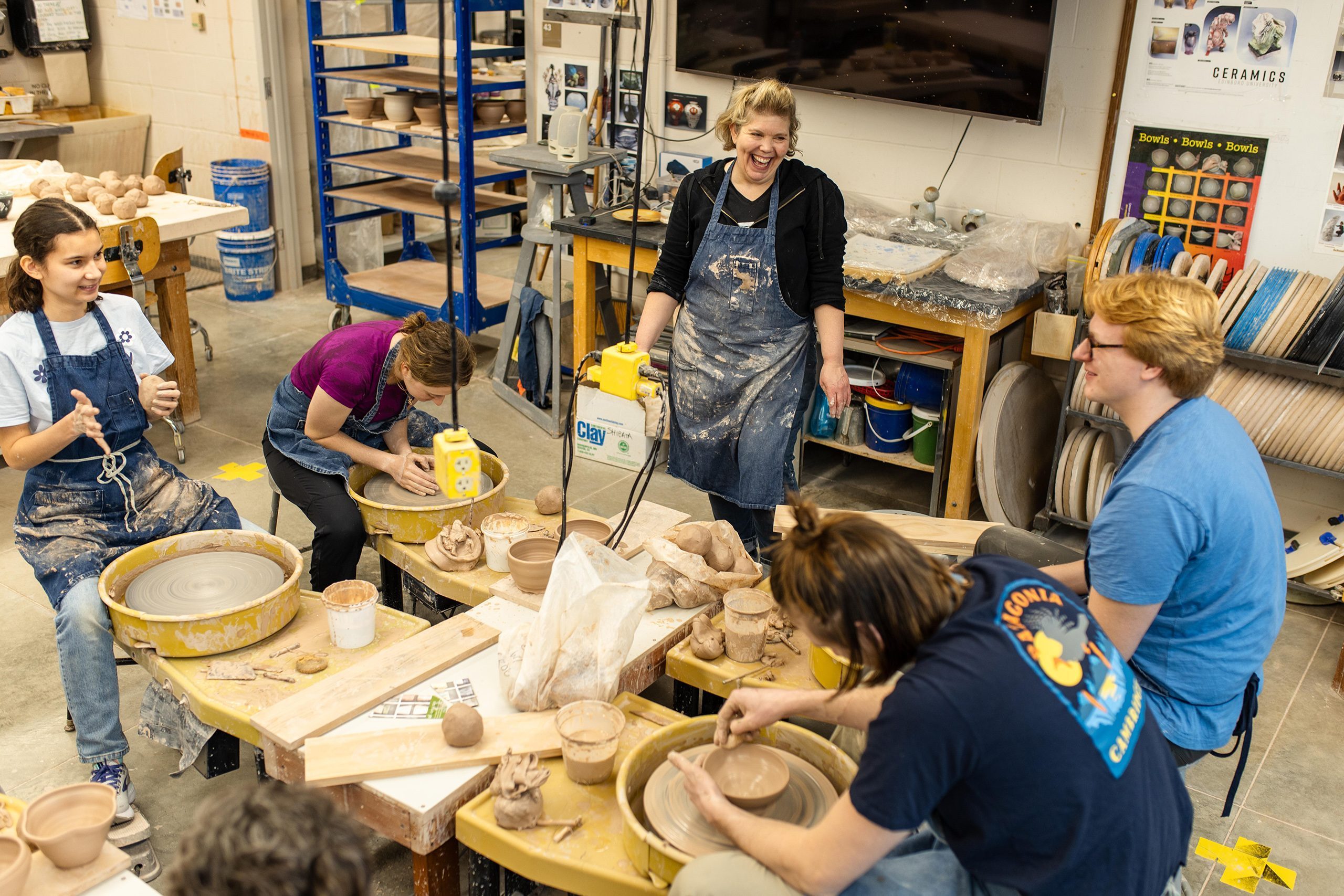 Students in a Ceramics Throwing ACE class with professor Kelly Connole