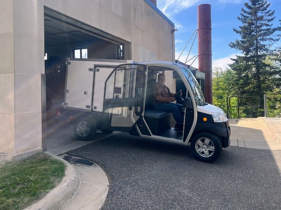 person driving electric cart