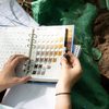 Student examining the color of soil in a soil notebook