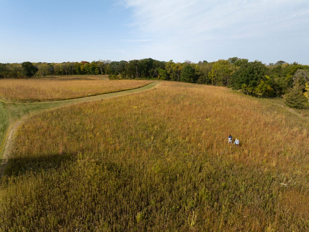 Aerial of the Arb with two people standing in grasses