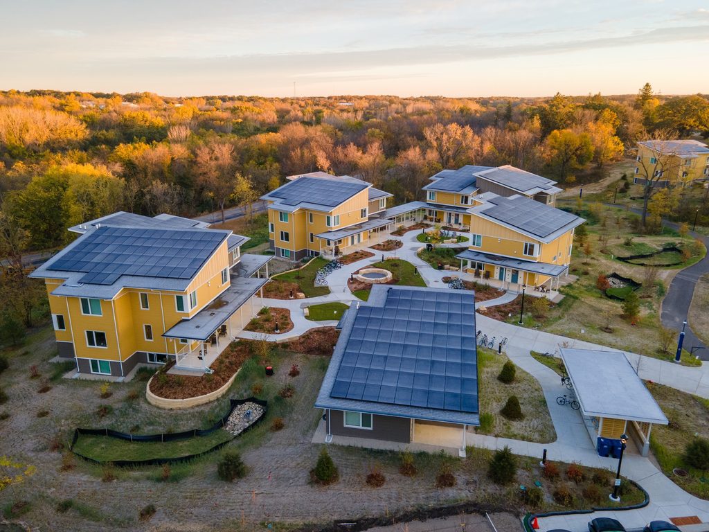 aerial view of houses with solar panels