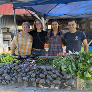 Amanda Sames, Maeve Clover, Meagen Roesler, and Daniel McGovern pose with produce haul