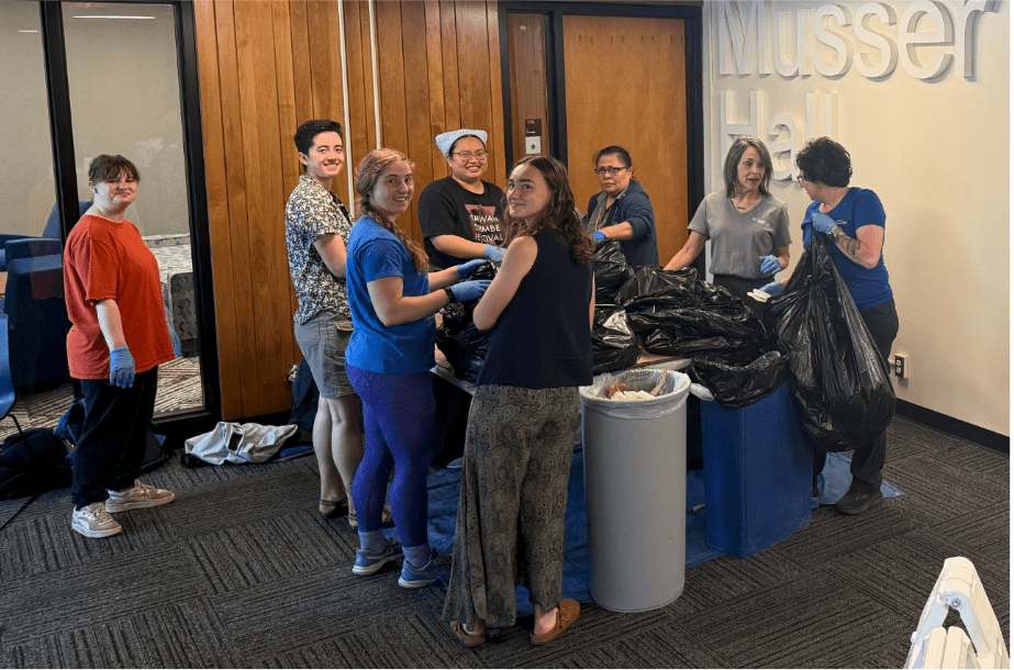 students gathering trash from musser hall