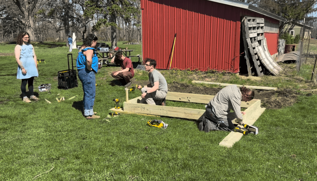 students building a raised garden bed