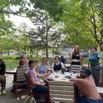 GWSS students and faculty posing for a group photo on the AGH patio at the spring '23 Strawberries & Chocolate Celebration.
