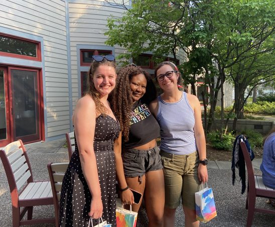 Three GWSS seniors posing for a photo on the AGH patio at the spring '23 Strawberries & Chocolate Celebration.