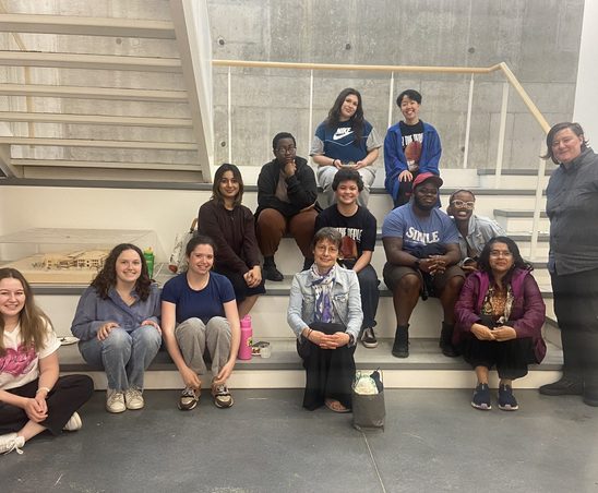 GWSS students and faculty posing for a group photo in the Weitz basement at the spring '24 Strawberries & Chocolate Celebration.