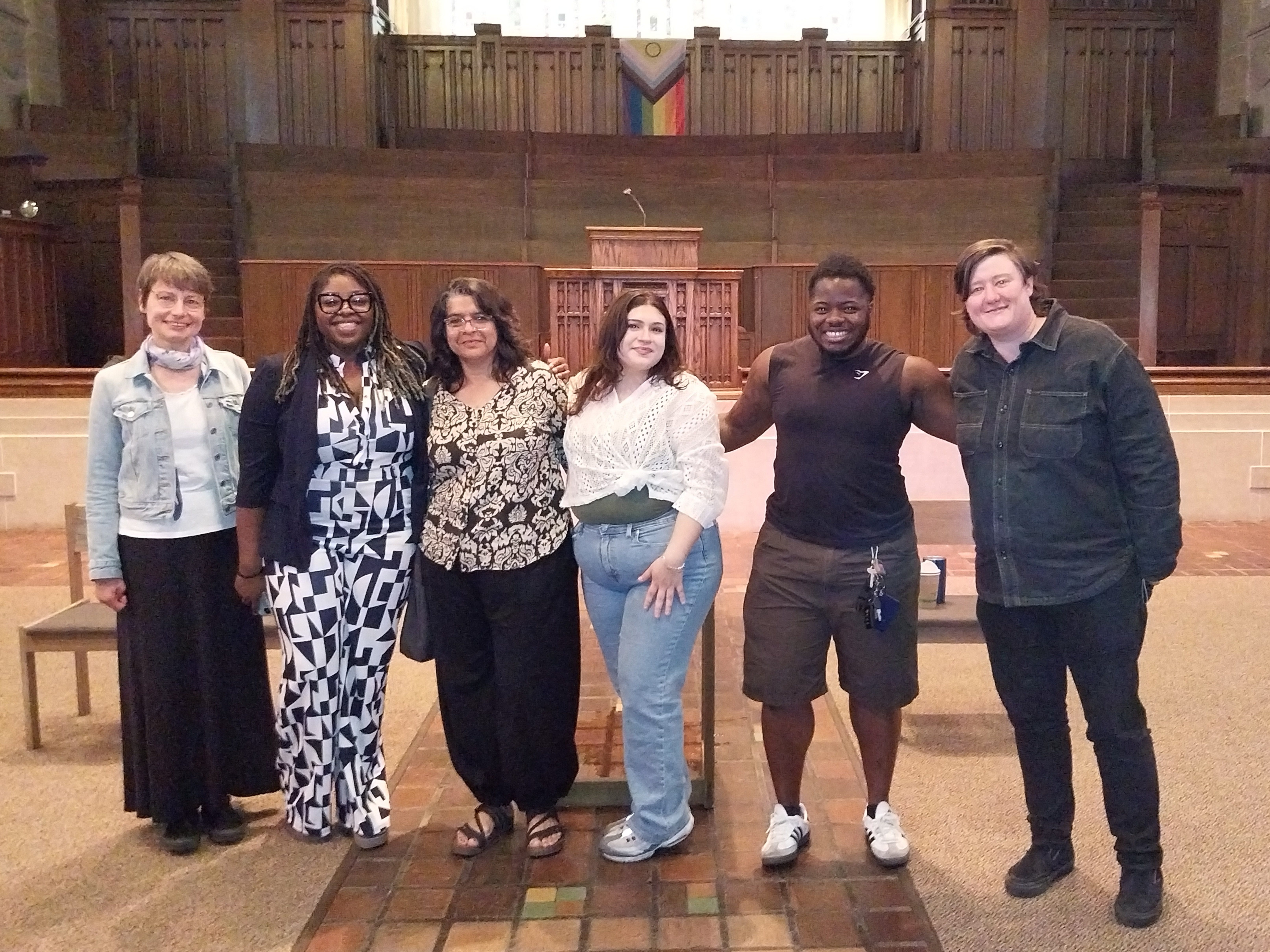 GWSS seniors and faculty members posing for a photo with Robin Wonsley '13 in Skinner Memorial Chapel.