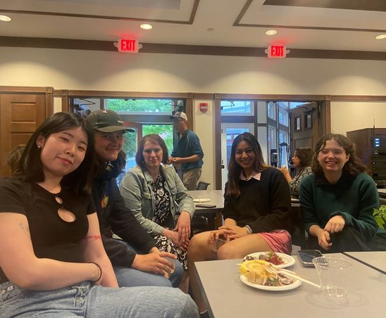 GWSS students and faculty posing for a photo at the spring '25 Strawberries & Chocolate Celebration.
