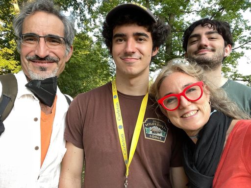Two college students with their parents
