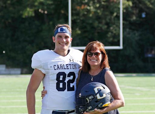 a football player and his mom