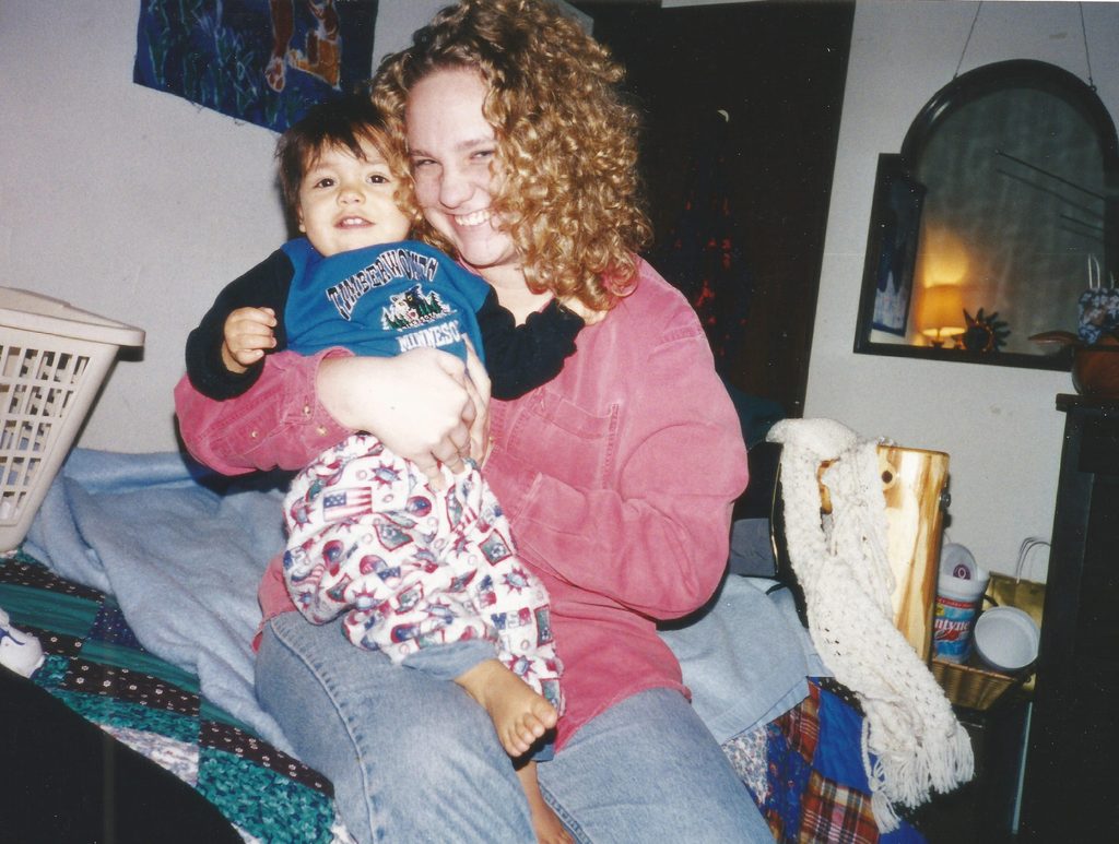 A young woman with a toddler