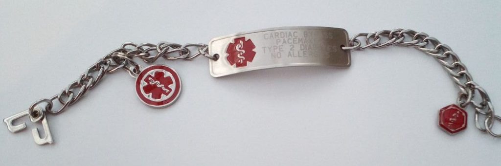 Photo of a medical alert bracelet, silver with description of medical conditions