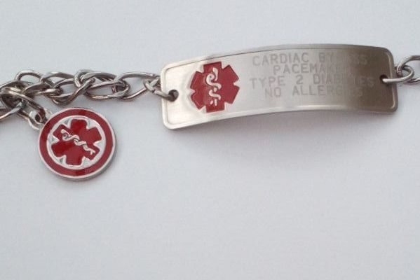 Photo of a medical alert bracelet, silver with description of medical conditions