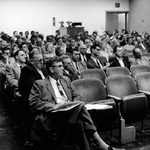 At a faculty meeting in Boliou Hall, 1958-59.