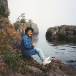 Mariko sitting along Lake Superior cove.